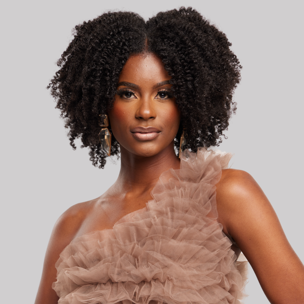 model with coily hair and representing natural hair products for coily hair type