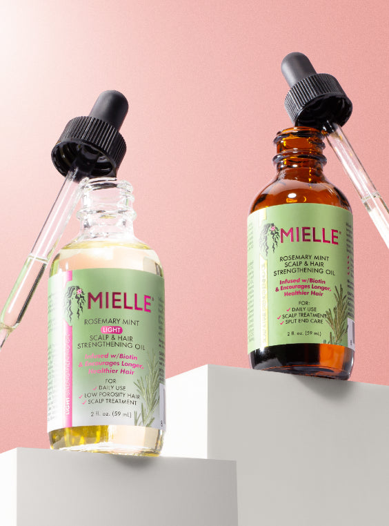 Two bottles of Mielle Rosemary Mint Scalp & Hair Strengthening Oil.