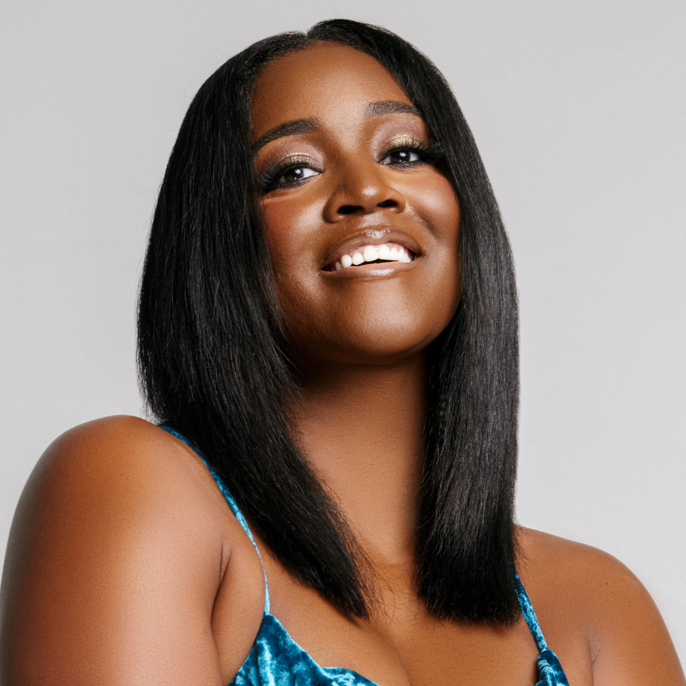 model with straightened hair and representing natural hair products for straightened hair type