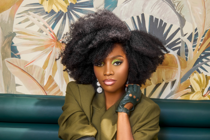 banner image for best products for 4c hair, girl applying products to her hair
